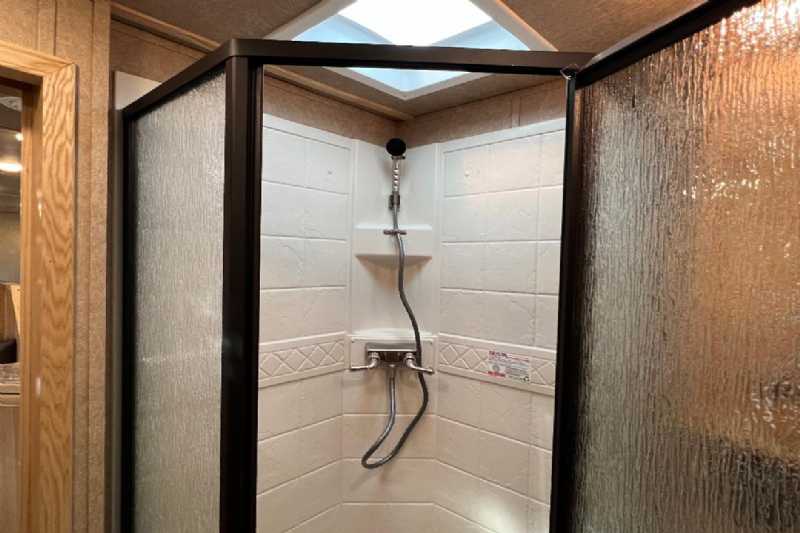 2024 Lakota Charger 8411RKGLQ 4 Horse Trailer with 11′ Short Wall - Image 12